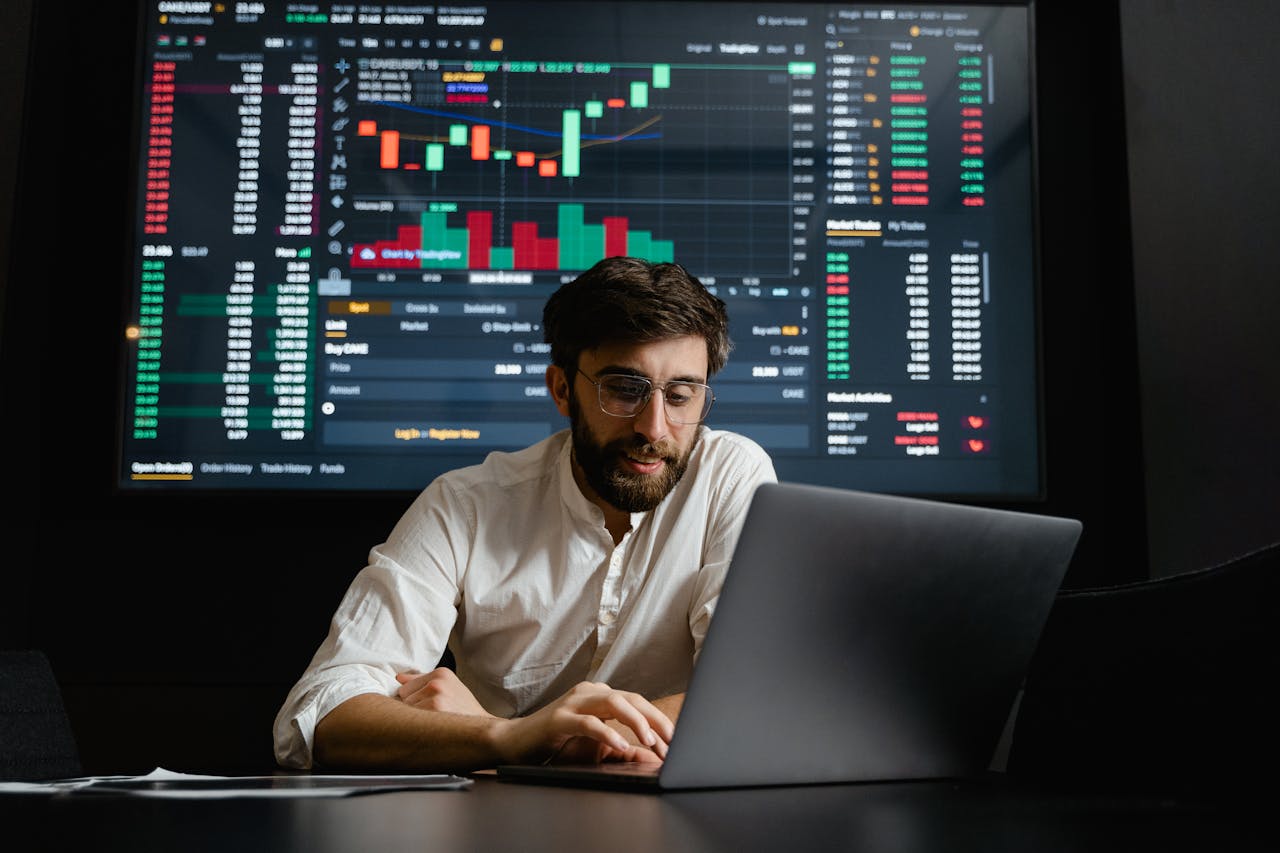 heros-img Male analyst studies cryptocurrency trends at a workstation with multiple displays showing market data.